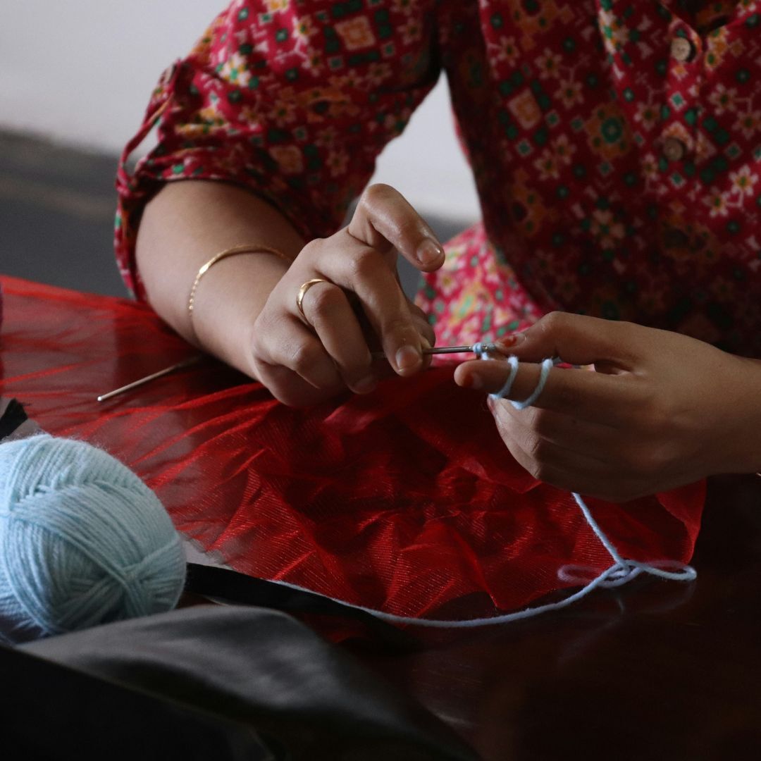 person working with yarn